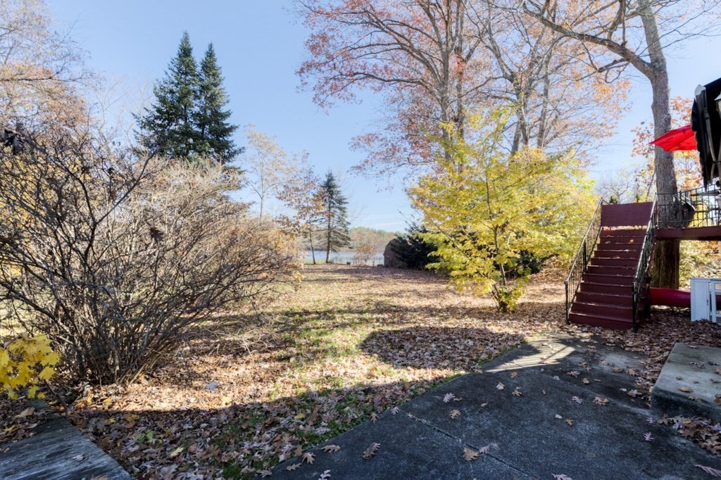 18 Bergin Lane Worcester, MA 01602 - Photo 8 of 42 a view of a yard with plants and trees