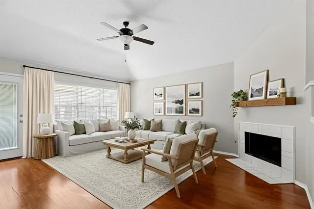 a living room with furniture and a fireplace