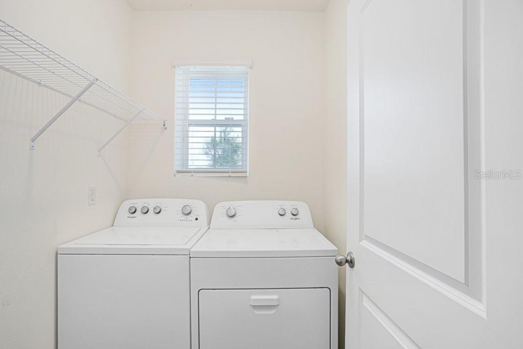 31210 Penny Surf Loop Wesley Chapel, FL 33545 - Photo 12 of 39 a utility room with dryer and washer