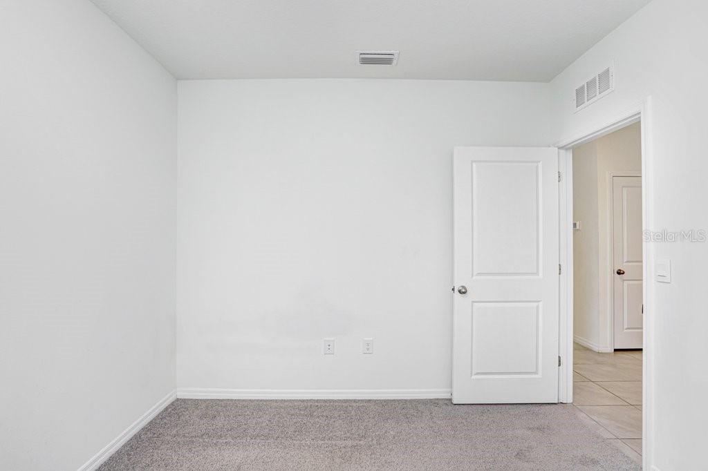 31210 Penny Surf Loop Wesley Chapel, FL 33545 - Photo 13 of 39 a view of an empty room