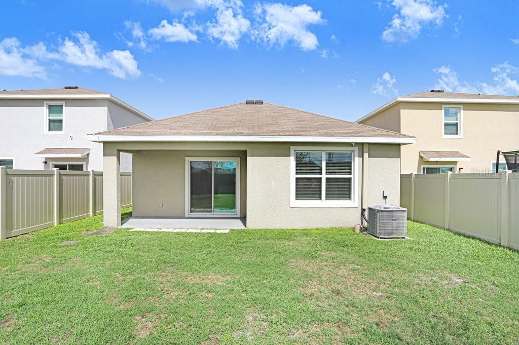 31210 Penny Surf Loop Wesley Chapel, FL 33545 - Photo 20 of 39 a front view of a house with a yard
