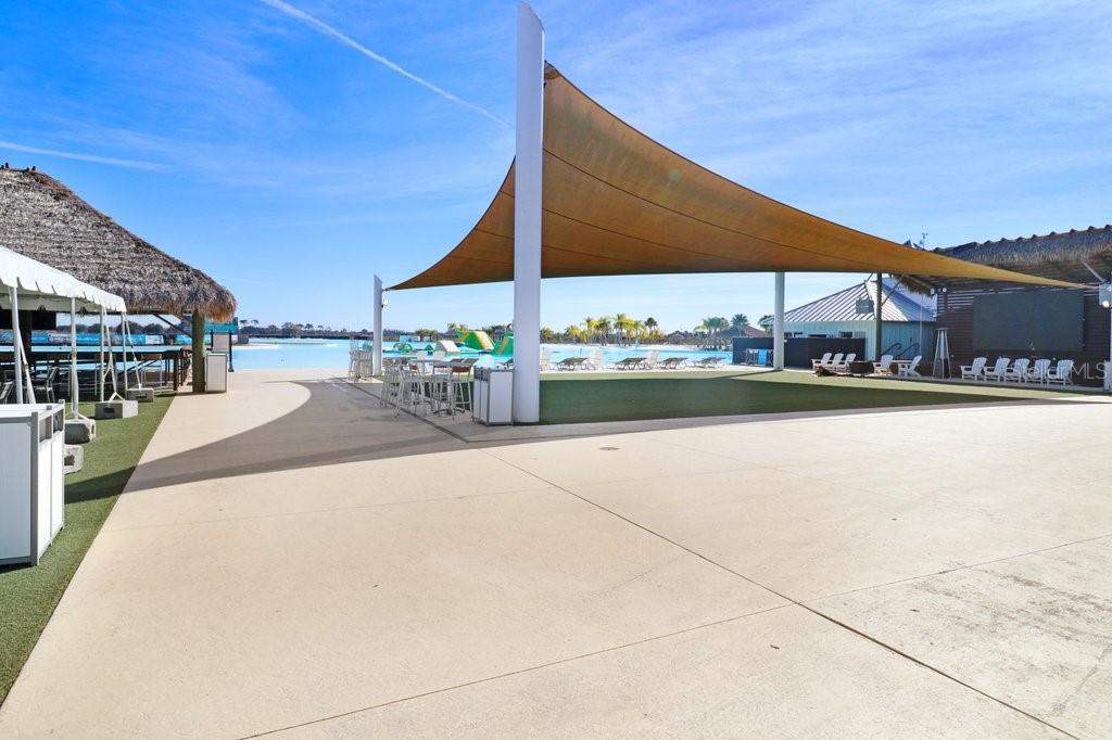 31210 Penny Surf Loop Wesley Chapel, FL 33545 - Photo 34 of 39 a view of a patio with a table and chairs under an umbrella