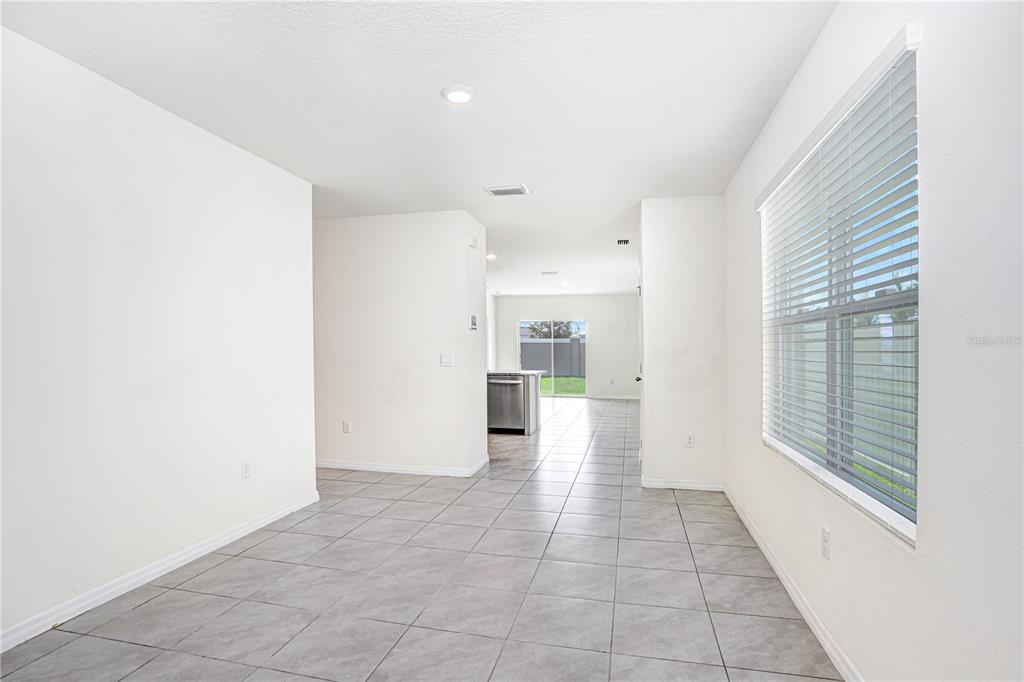 31210 Penny Surf Loop Wesley Chapel, FL 33545 - Photo 6 of 39 a view of a big room with windows and entryway
