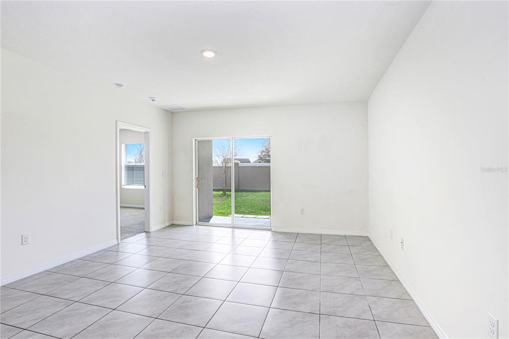 31210 Penny Surf Loop Wesley Chapel, FL 33545 - Photo 7 of 39 a view of an empty room with a fireplace