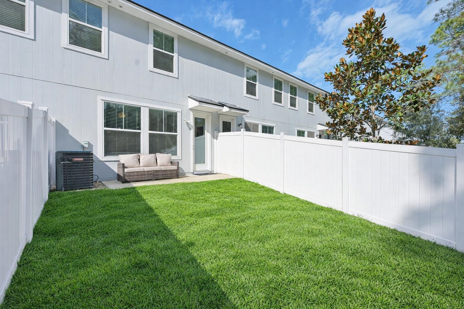 22 Ridge Lake Road St. Augustine, FL 32086 - Photo 19 of 31 Rear view of house featuring outdoor lounge area and a patio