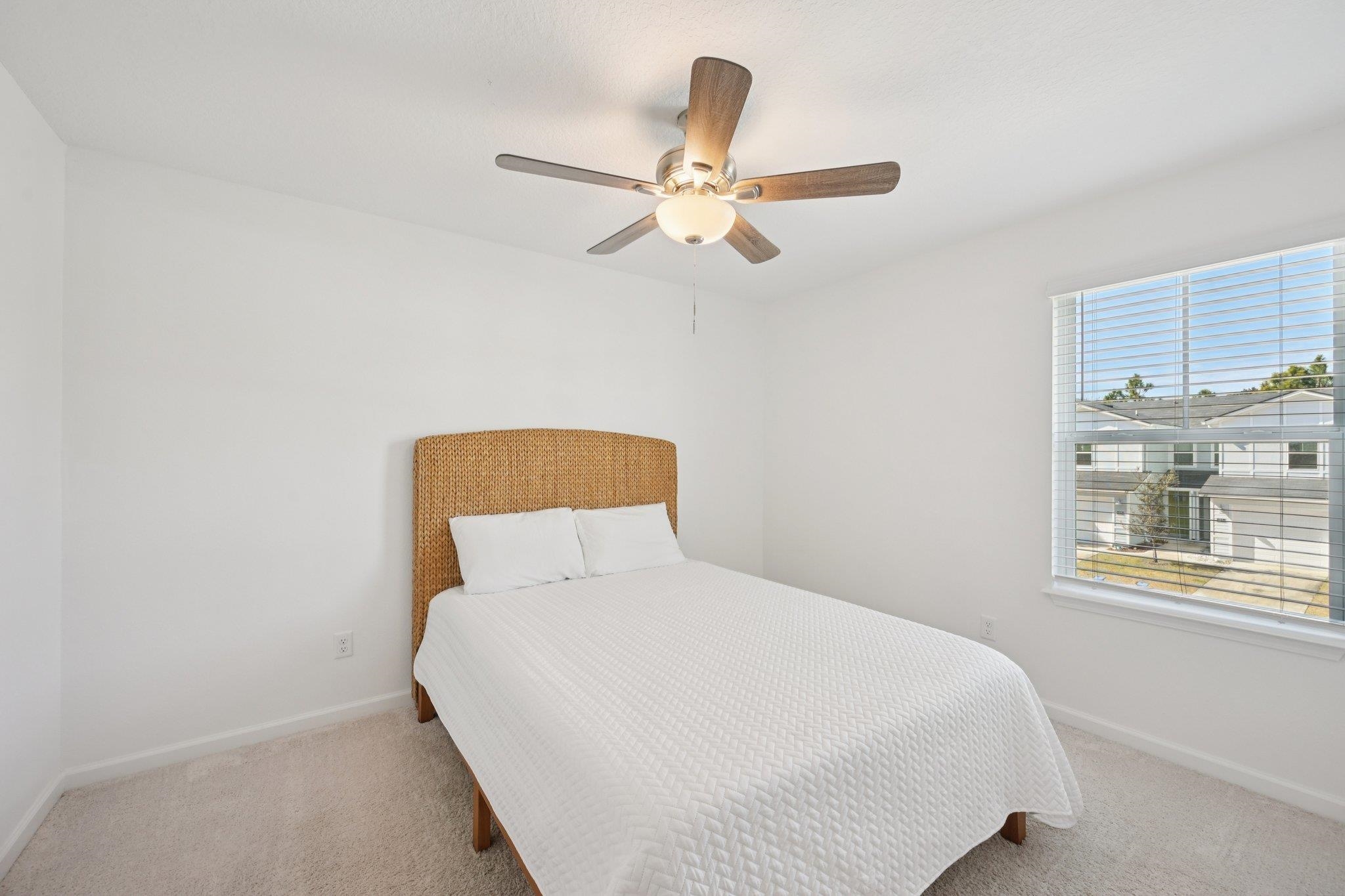 22 Ridge Lake Road St. Augustine, FL 32086 - Photo 26 of 31 Bedroom with a ceiling fan and light colored carpet