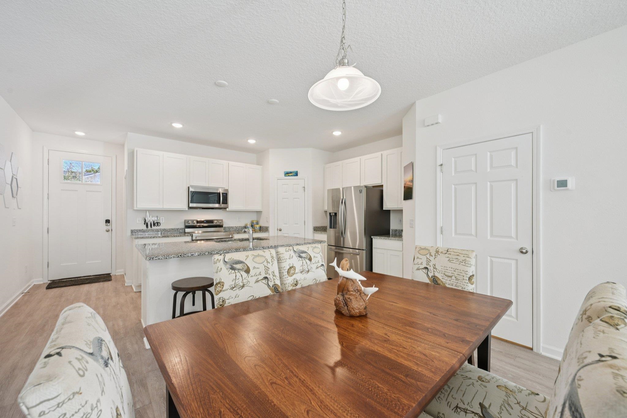 22 Ridge Lake Road St. Augustine, FL 32086 - Photo 7 of 31 Dining area featuring light wood finished floors, a textured ceiling, and recessed lighting