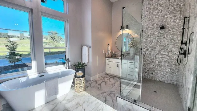 a bathroom with a double vanity sink toilet and mirror