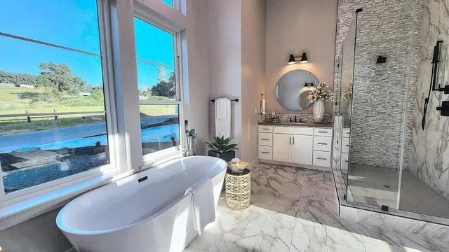 a bathroom with a granite countertop sink a toilet and a mirror