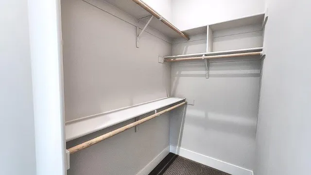 a bedroom with a bed couch and window