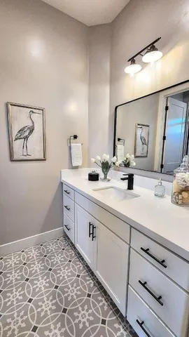 a very nice looking room with a large window and chandelier