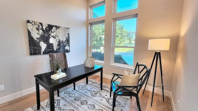 an aerial view of house with yard and green space