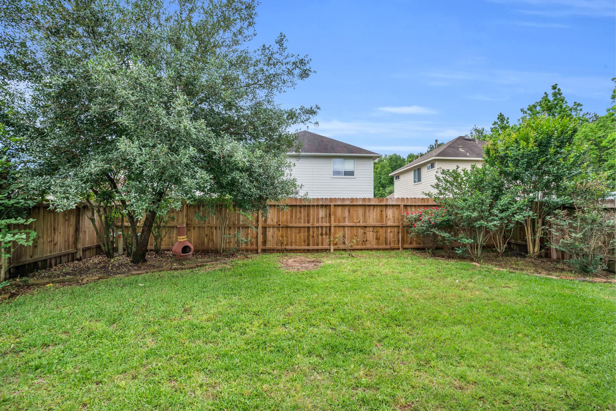 7215 Cool Spring Court Magnolia, TX 77354 - Photo 22 of 23 a view of a house with a yard and deck
