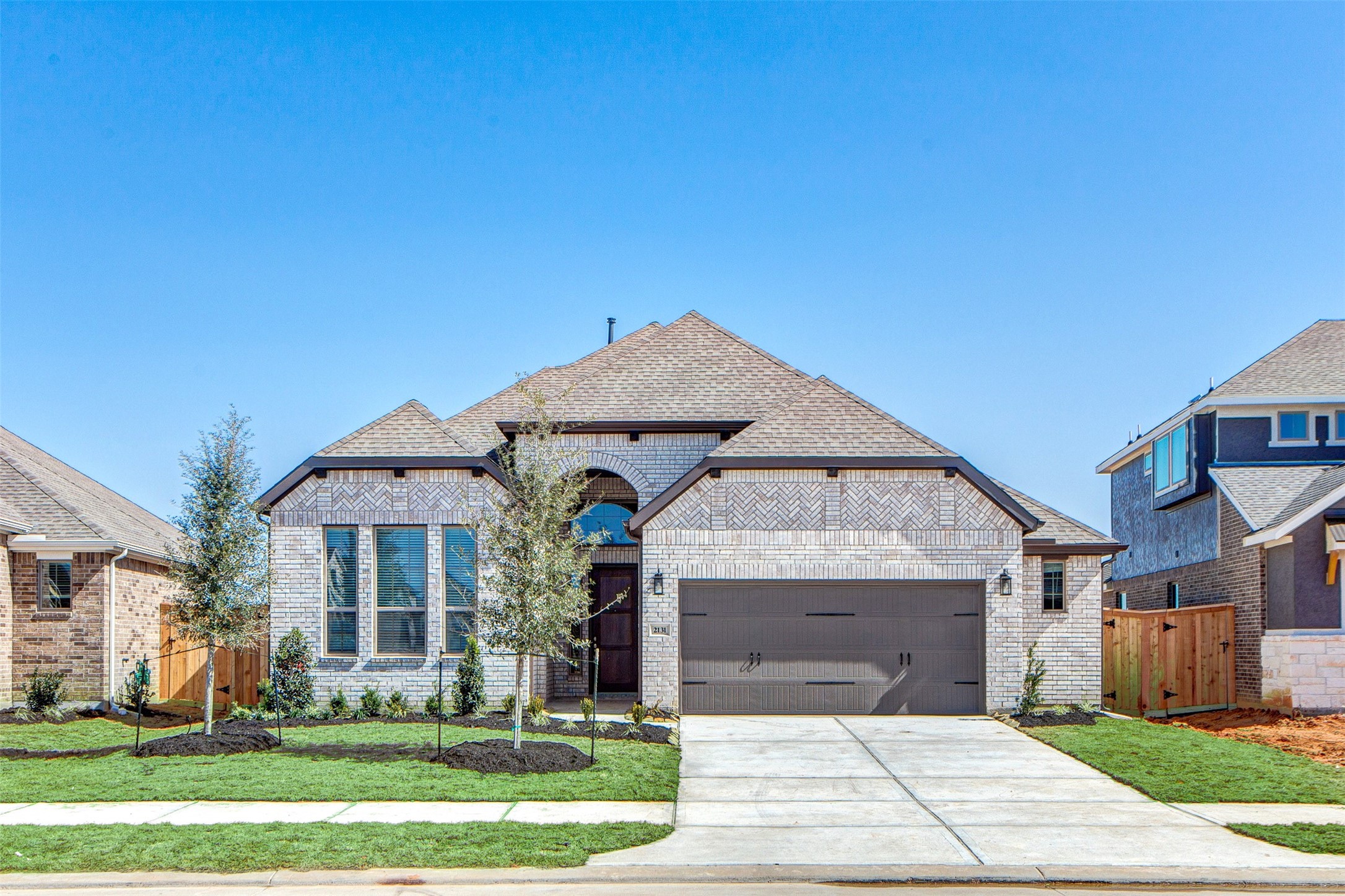 a front view of a house with a yard