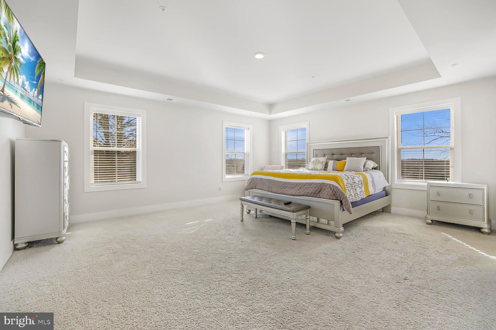 23420 Woodfield Road Gaithersburg, MD 20882 - Photo 17 of 50 a bedroom with a bed and a window