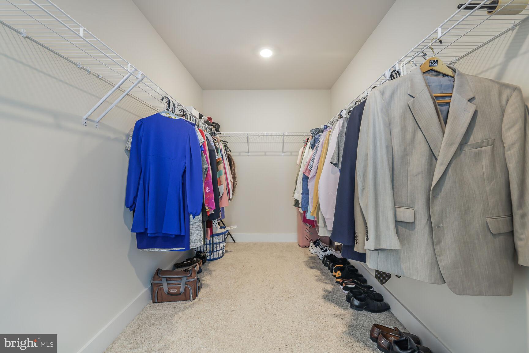 23420 Woodfield Road Gaithersburg, MD 20882 - Photo 23 of 50 a view of walk in closet with clothes
