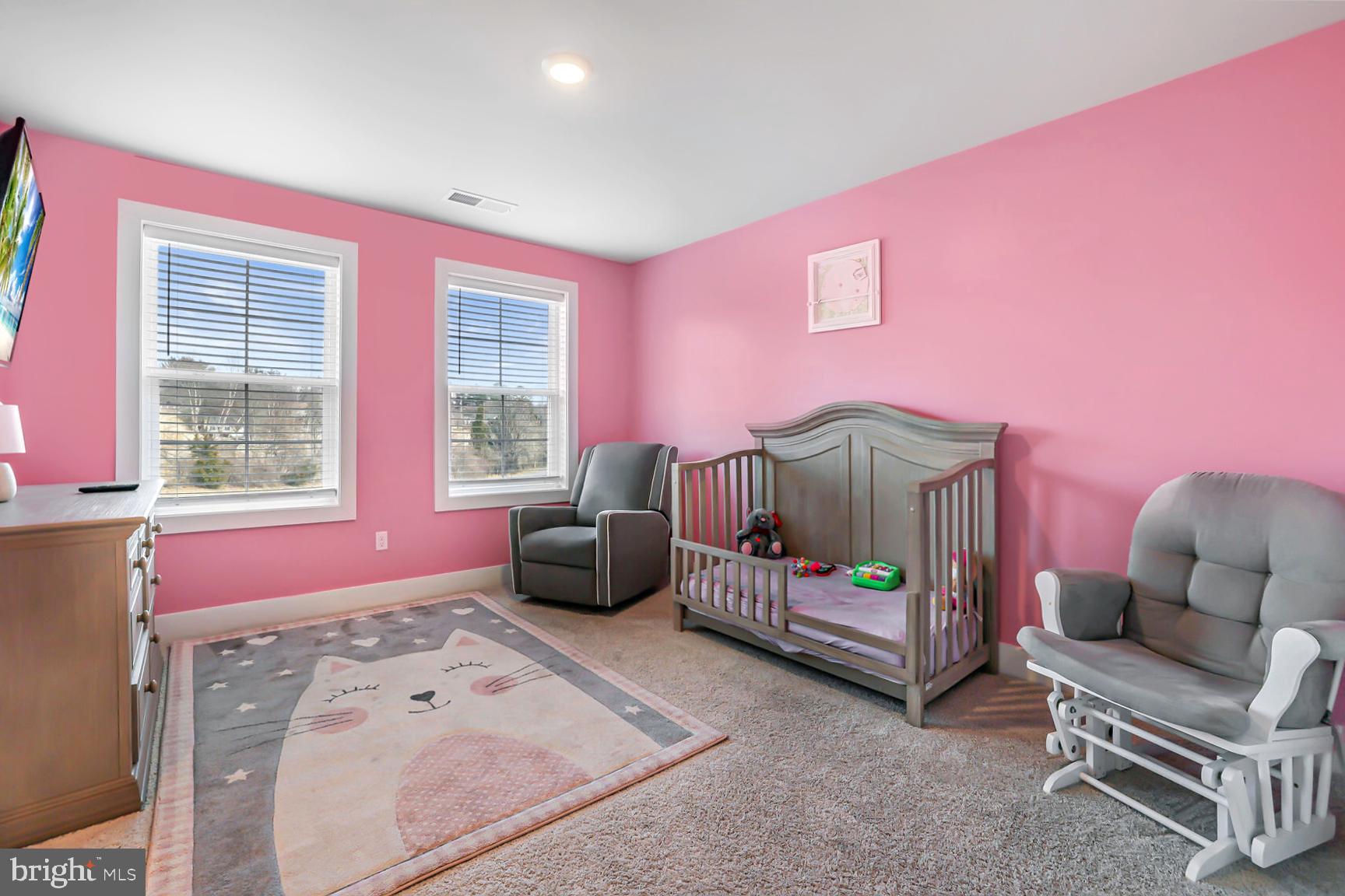 23420 Woodfield Road Gaithersburg, MD 20882 - Photo 24 of 50 a bedroom with furniture and a window