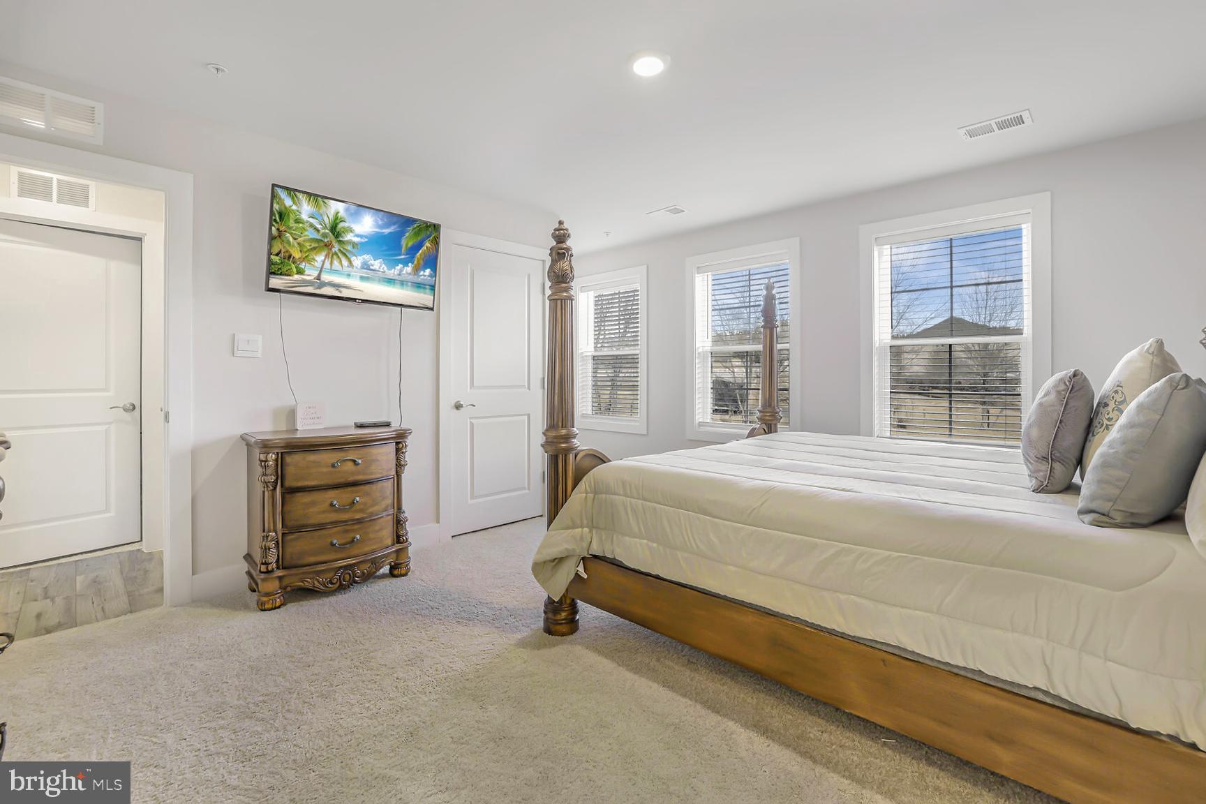 23420 Woodfield Road Gaithersburg, MD 20882 - Photo 28 of 50 a bedroom with a bed and a window