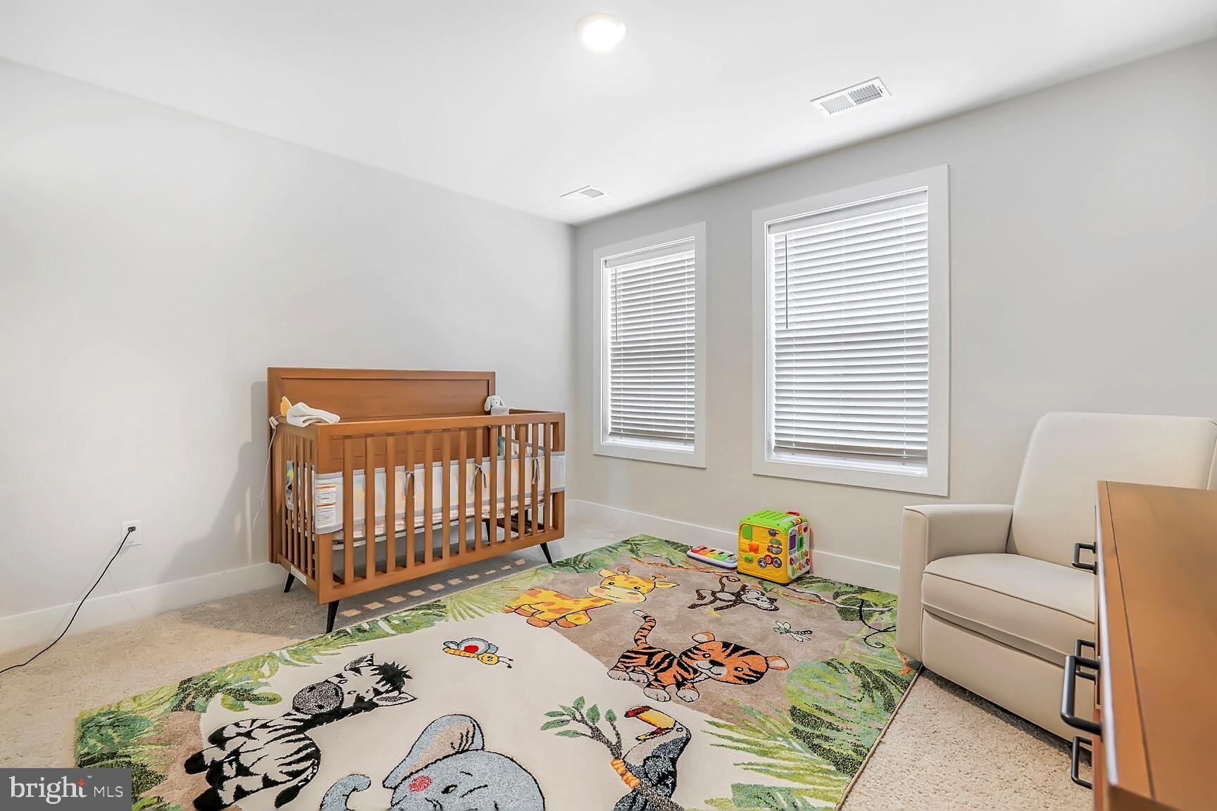 23420 Woodfield Road Gaithersburg, MD 20882 - Photo 29 of 50 a bedroom with a bed and a couch