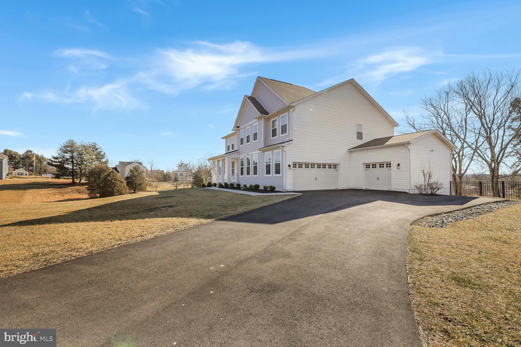 23420 Woodfield Road Gaithersburg, MD 20882 - Photo 44 of 50 a view of white house with a road