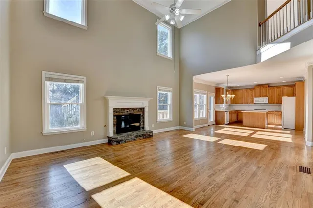 a kitchen with stainless steel appliances granite countertop a stove a sink dishwasher and a refrigerator