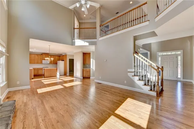 a kitchen with granite countertop cabinets and refrigerator