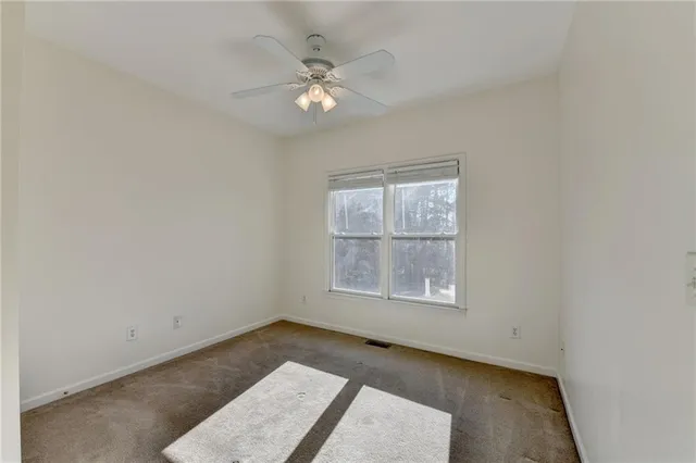 a spacious bathroom with a double vanity sink mirror and shower