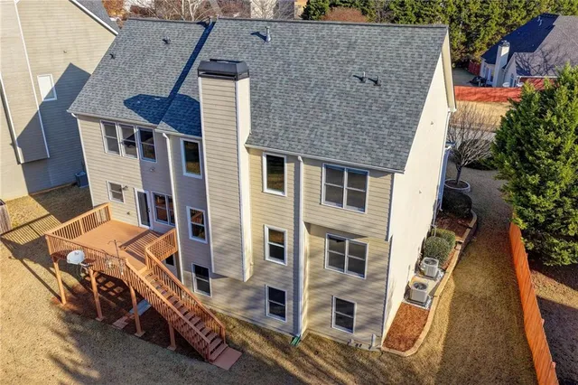 an aerial view of residential houses with outdoor space