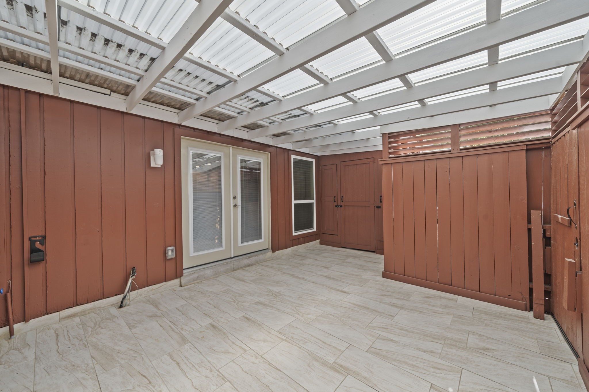 5801 Lumberdale Road, Unit 132 Houston, TX 77092 - Photo 7 of 33 Covered patio with storage perfect for low-maintenance outdoor living