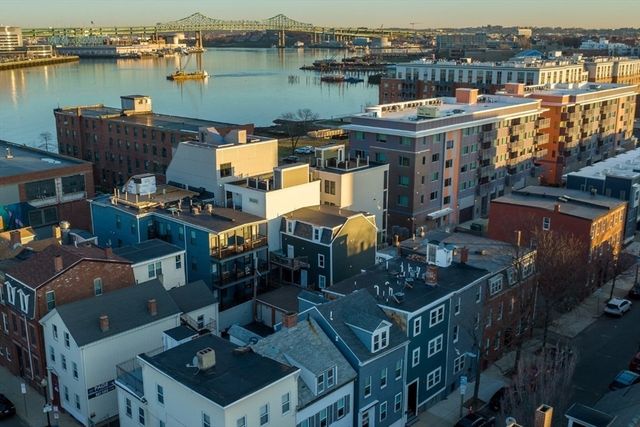 an aerial view of a house with outdoor space