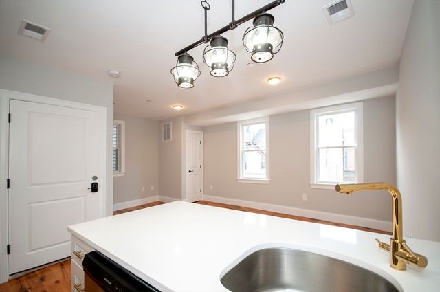 a spacious bathroom with a bathtub and a sink