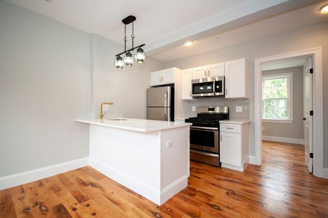 a kitchen with a stove and a sink