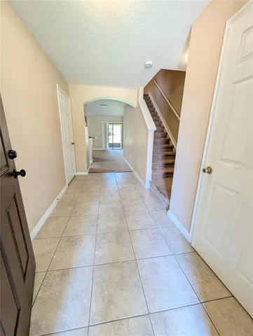 a view of a livingroom with a staircase