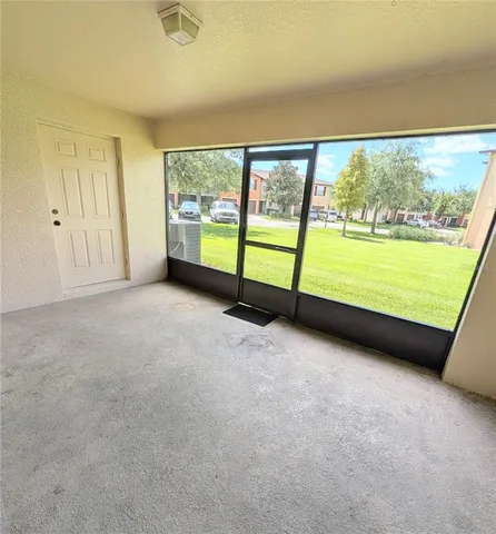 a view of an empty room with a large window