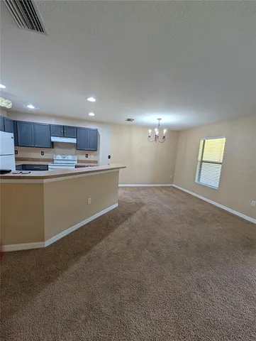 a kitchen with stainless steel appliances granite countertop a refrigerator sink and cabinets