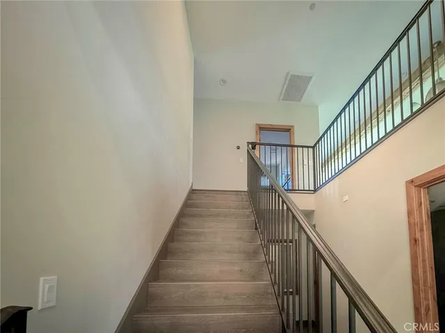 a room with pool table and windows