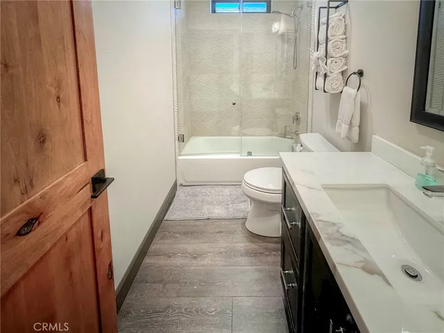 a bathroom with a bathtub and shower