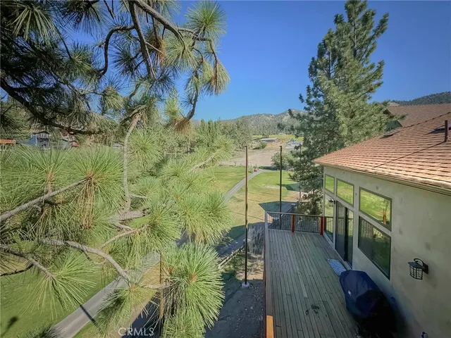 a view of balcony with wooden floor and outdoor space