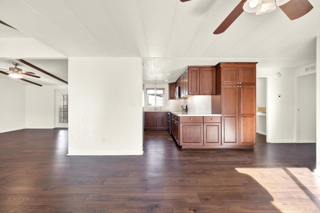 9255 North Magnolia Avenue, Unit SPC 158 Santee, CA 92071 - Photo 13 of 49 a living room with furniture and a wooden floor