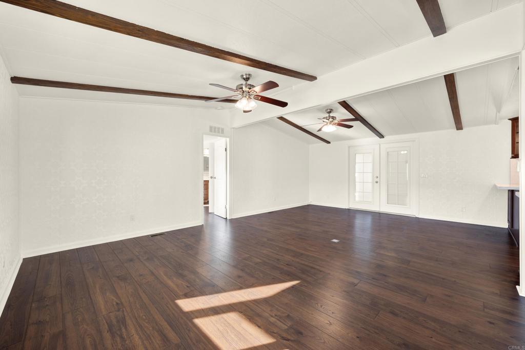 9255 North Magnolia Avenue, Unit SPC 158 Santee, CA 92071 - Photo 14 of 49 a view of a big room with wooden floor and windows