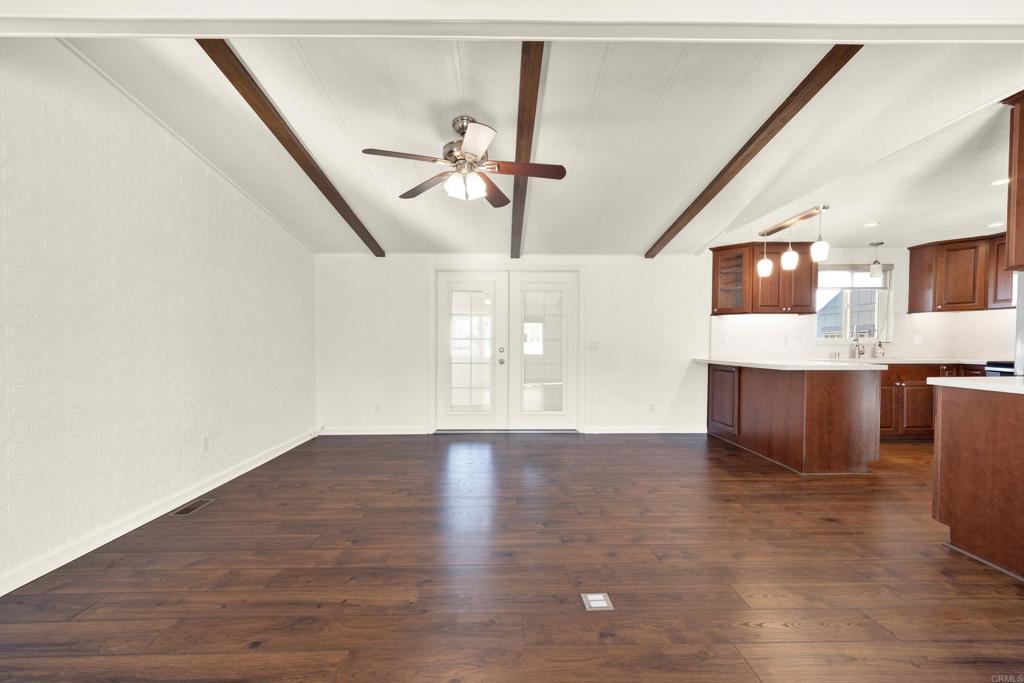 9255 North Magnolia Avenue, Unit SPC 158 Santee, CA 92071 - Photo 16 of 49 a view of an empty room with kitchen and a window