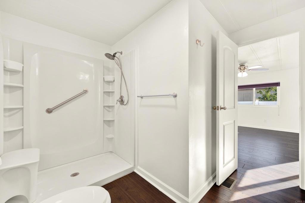 9255 North Magnolia Avenue, Unit SPC 158 Santee, CA 92071 - Photo 27 of 49 a bathroom with a glass shower door