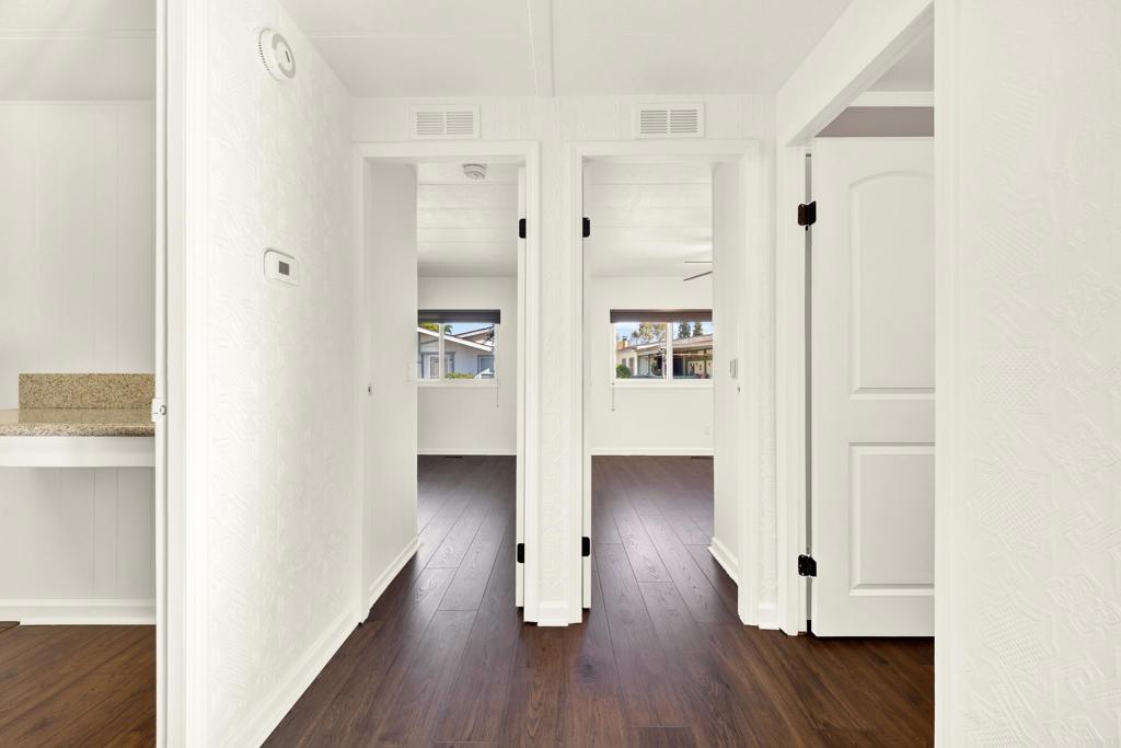 9255 North Magnolia Avenue, Unit SPC 158 Santee, CA 92071 - Photo 28 of 49 a view of a hallway with wooden floor