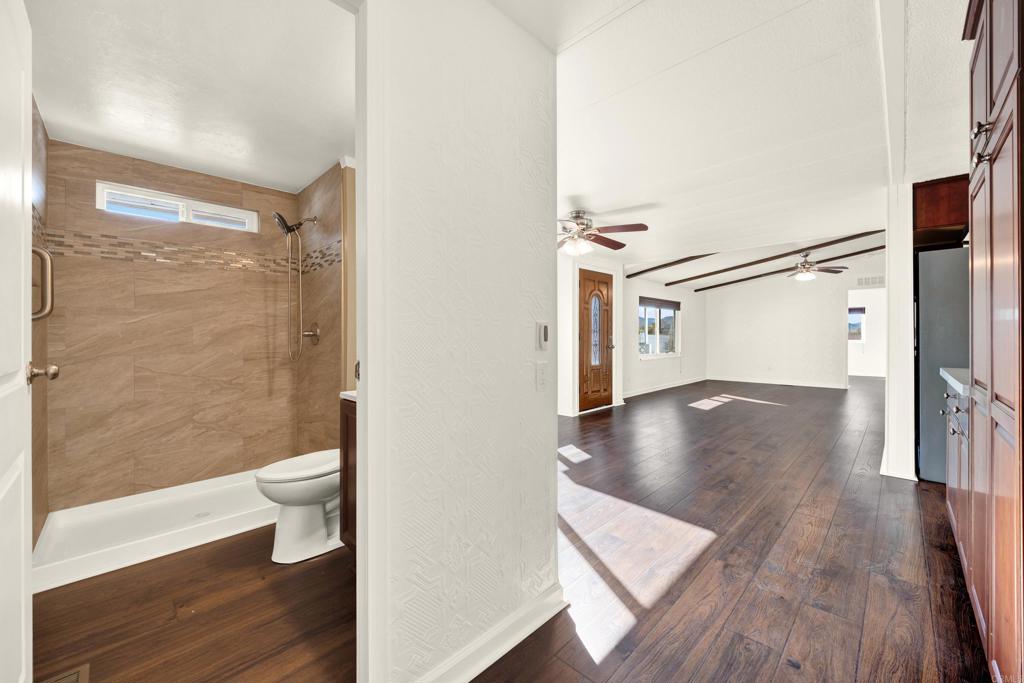 9255 North Magnolia Avenue, Unit SPC 158 Santee, CA 92071 - Photo 29 of 49 a view of a bathroom with a toilet and a shower
