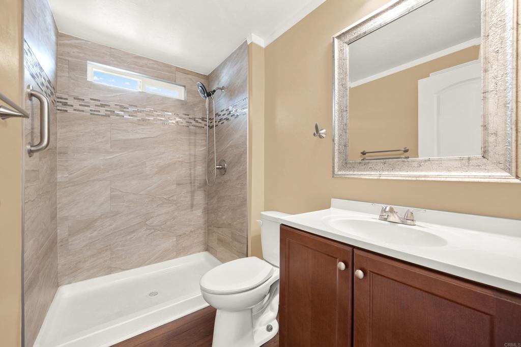 9255 North Magnolia Avenue, Unit SPC 158 Santee, CA 92071 - Photo 31 of 49 a bathroom with a sink a toilet and a bathtub