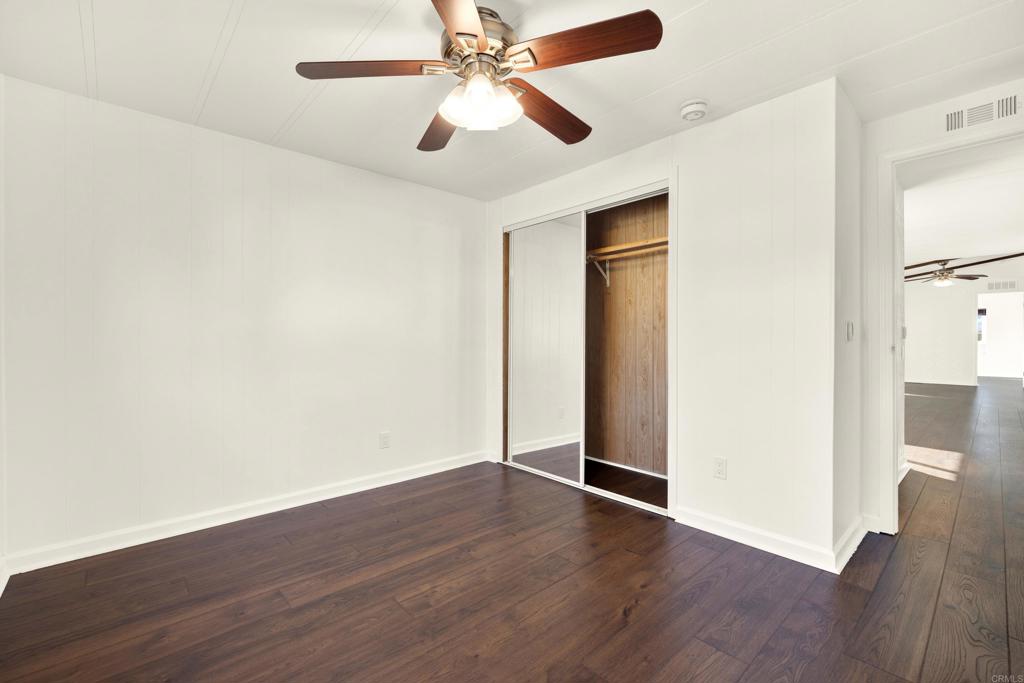 9255 North Magnolia Avenue, Unit SPC 158 Santee, CA 92071 - Photo 34 of 49 a view of an empty room with wooden floor