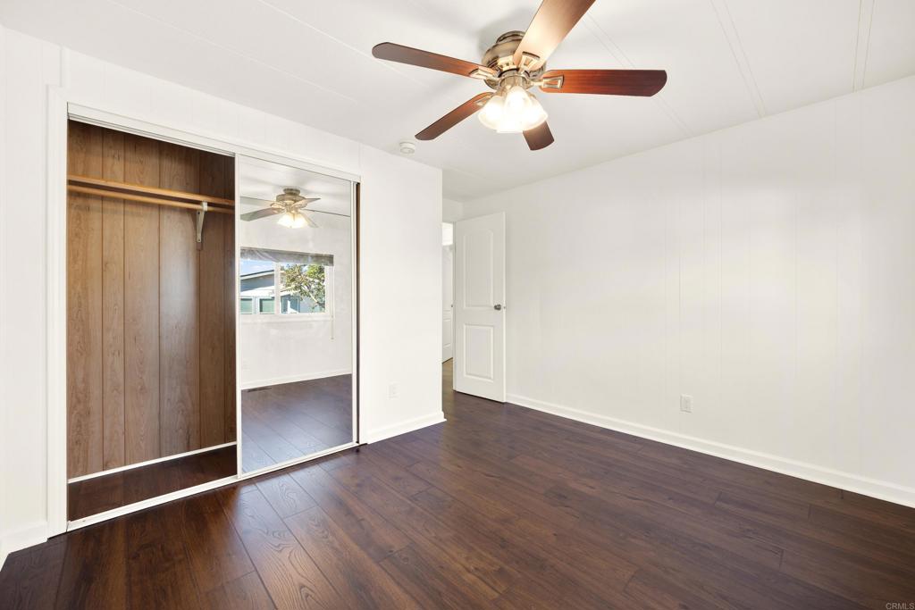9255 North Magnolia Avenue, Unit SPC 158 Santee, CA 92071 - Photo 35 of 49 a view of an empty room with wooden floor