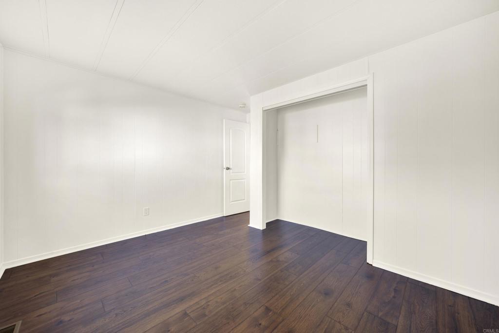 9255 North Magnolia Avenue, Unit SPC 158 Santee, CA 92071 - Photo 38 of 49 a view of an empty room with wooden floor