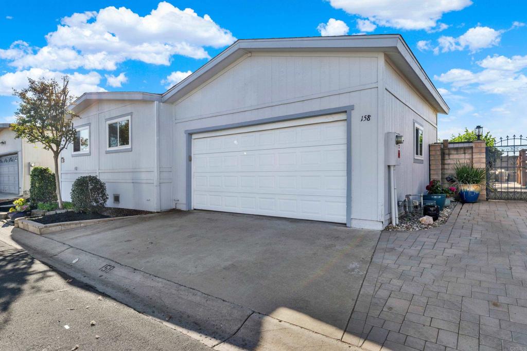 9255 North Magnolia Avenue, Unit SPC 158 Santee, CA 92071 - Photo 40 of 49 a view of a house with a backyard