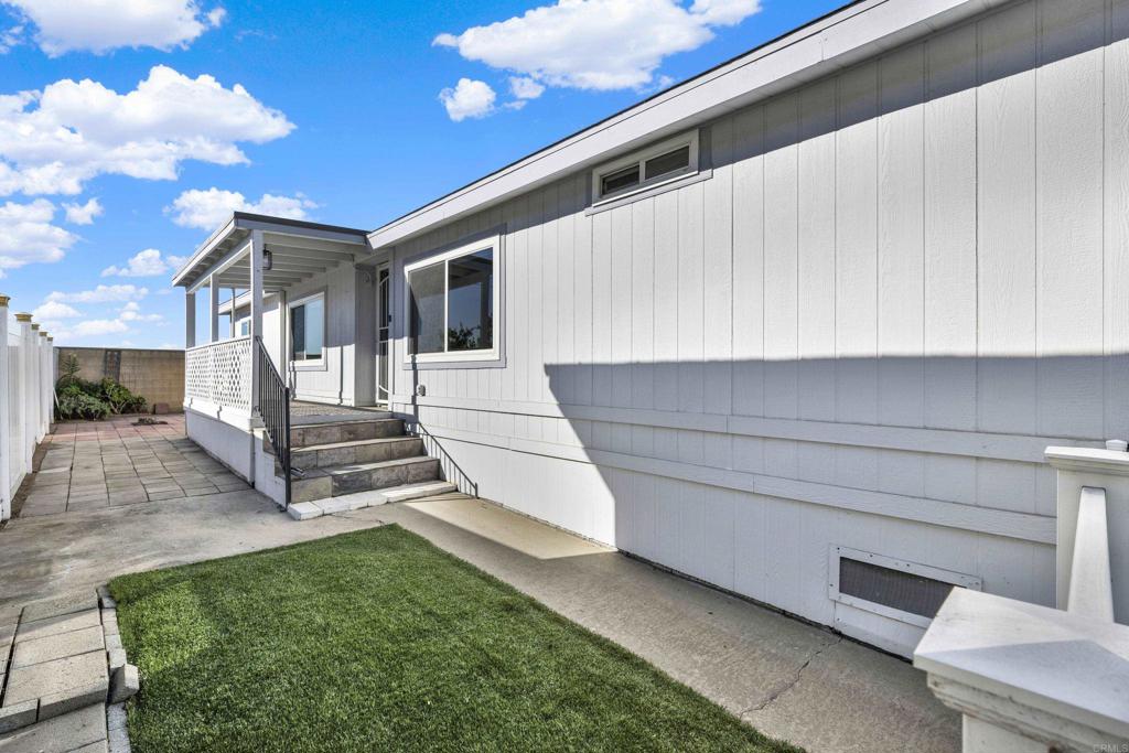 9255 North Magnolia Avenue, Unit SPC 158 Santee, CA 92071 - Photo 45 of 49 a bathroom with a sink and a mirror